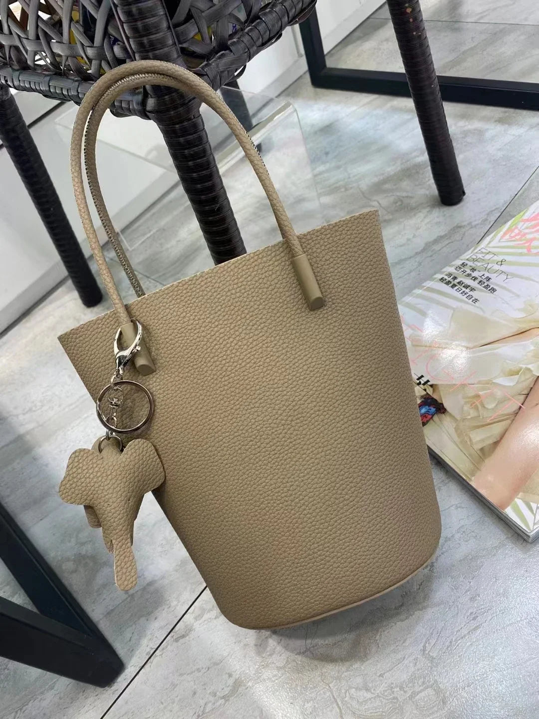 2024 Most Popular Togo Cowhide Leather Bucket Bag Small Neat All-match Elegant Women Shoulder Bag with Elephant Ornaments