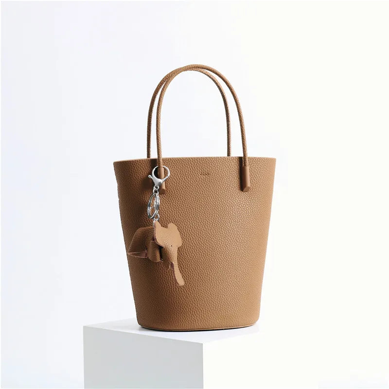 2024 Most Popular Togo Cowhide Leather Bucket Bag Small Neat All-match Elegant Women Shoulder Bag with Elephant Ornaments