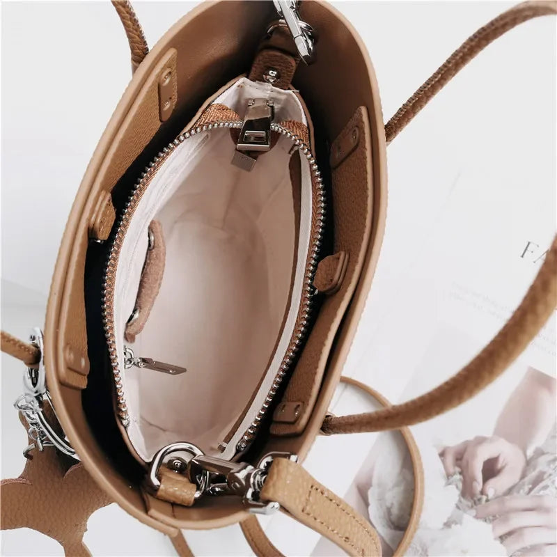 2024 Most Popular Togo Cowhide Leather Bucket Bag Small Neat All-match Elegant Women Shoulder Bag with Elephant Ornaments