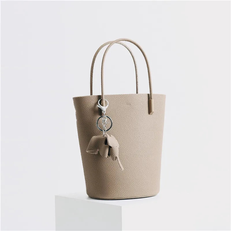 2024 Most Popular Togo Cowhide Leather Bucket Bag Small Neat All-match Elegant Women Shoulder Bag with Elephant Ornaments