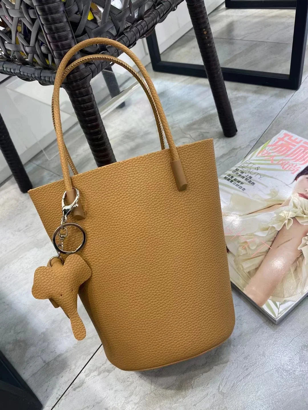 2024 Most Popular Togo Cowhide Leather Bucket Bag Small Neat All-match Elegant Women Shoulder Bag with Elephant Ornaments