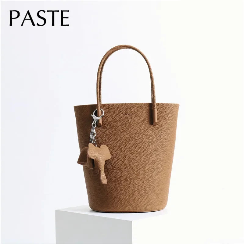 2024 Most Popular Togo Cowhide Leather Bucket Bag Small Neat All-match Elegant Women Shoulder Bag with Elephant Ornaments