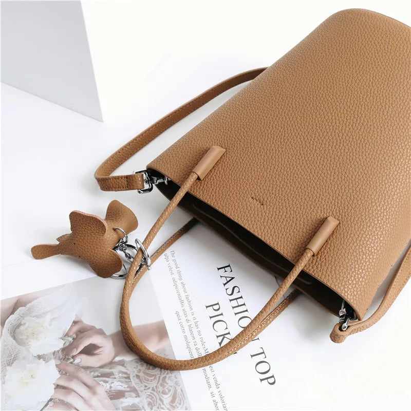 2024 Most Popular Togo Cowhide Leather Bucket Bag Small Neat All-match Elegant Women Shoulder Bag with Elephant Ornaments