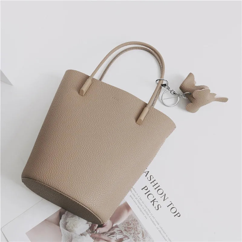 2024 Most Popular Togo Cowhide Leather Bucket Bag Small Neat All-match Elegant Women Shoulder Bag with Elephant Ornaments