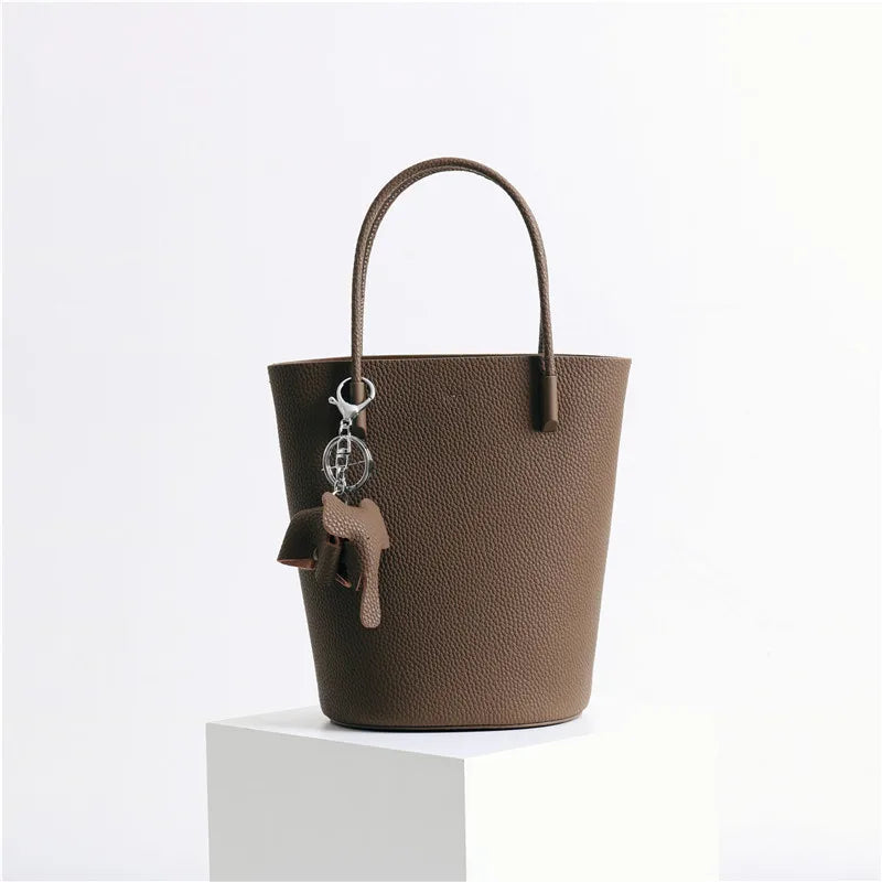 2024 Most Popular Togo Cowhide Leather Bucket Bag Small Neat All-match Elegant Women Shoulder Bag with Elephant Ornaments