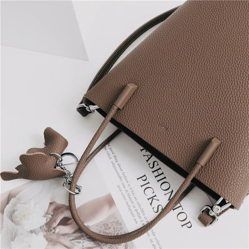 2024 Most Popular Togo Cowhide Leather Bucket Bag Small Neat All-match Elegant Women Shoulder Bag with Elephant Ornaments