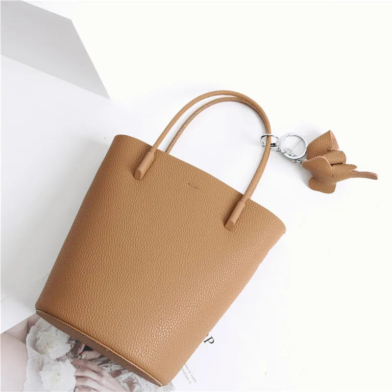 2024 Most Popular Togo Cowhide Leather Bucket Bag Small Neat All-match Elegant Women Shoulder Bag with Elephant Ornaments