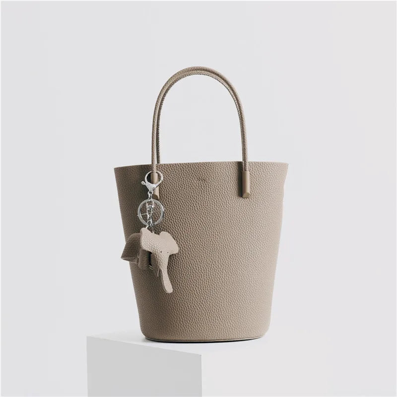 2024 Most Popular Togo Cowhide Leather Bucket Bag Small Neat All-match Elegant Women Shoulder Bag with Elephant Ornaments