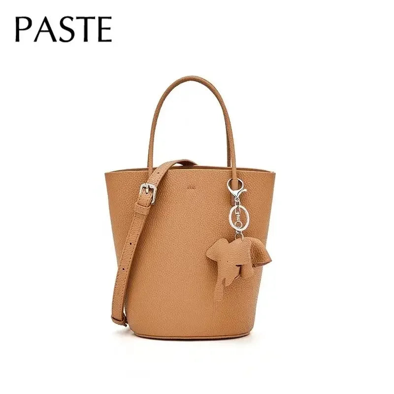 2024 Most Popular Togo Cowhide Leather Bucket Bag Small Neat All-match Elegant Women Shoulder Bag with Elephant Ornaments