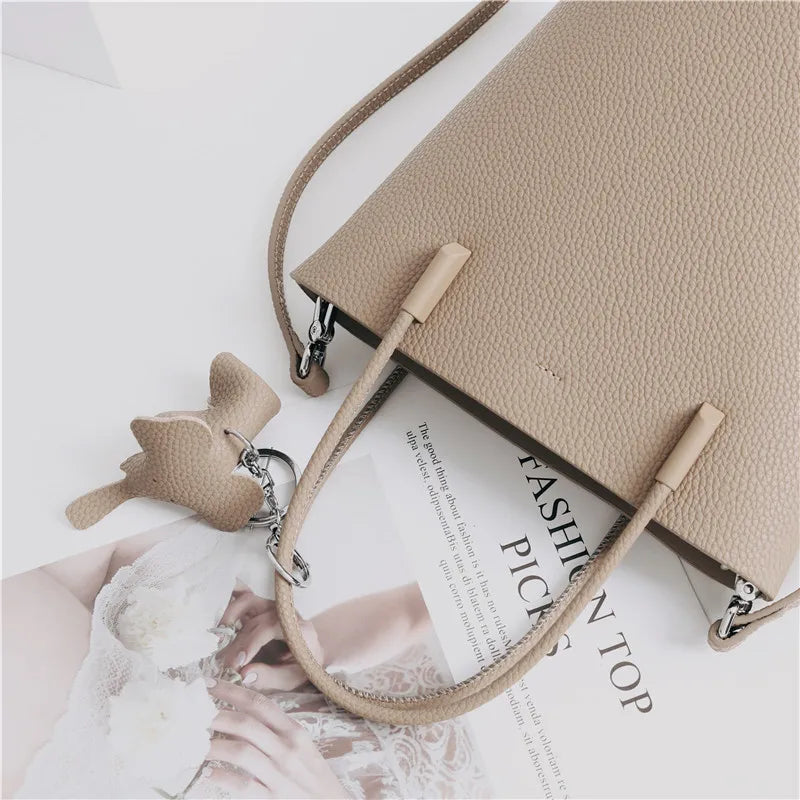 2024 Most Popular Togo Cowhide Leather Bucket Bag Small Neat All-match Elegant Women Shoulder Bag with Elephant Ornaments