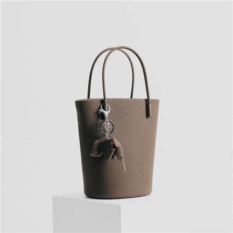 2024 Most Popular Togo Cowhide Leather Bucket Bag Small Neat All-match Elegant Women Shoulder Bag with Elephant Ornaments