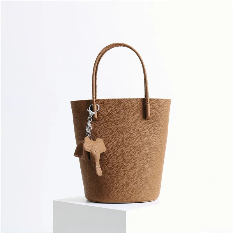 2024 Most Popular Togo Cowhide Leather Bucket Bag Small Neat All-match Elegant Women Shoulder Bag with Elephant Ornaments