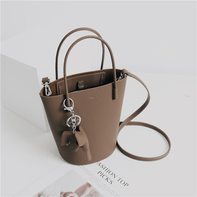 2024 Most Popular Togo Cowhide Leather Bucket Bag Small Neat All-match Elegant Women Shoulder Bag with Elephant Ornaments